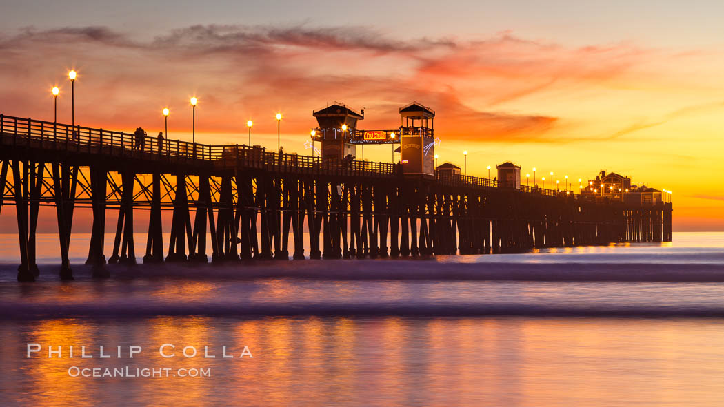 Oceanside Pier at sunset, clouds with a brilliant sky at dusk, the lights on the pier are lit. California, USA, natural history stock photograph, photo id 27614