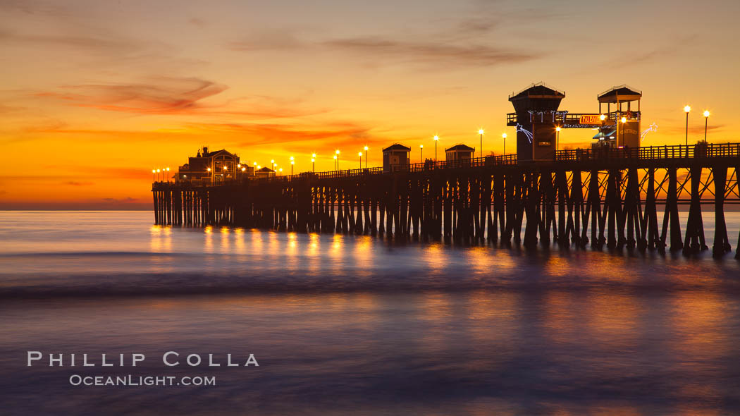 Oceanside Pier at sunset, clouds with a brilliant sky at dusk, the lights on the pier are lit. California, USA, natural history stock photograph, photo id 27616