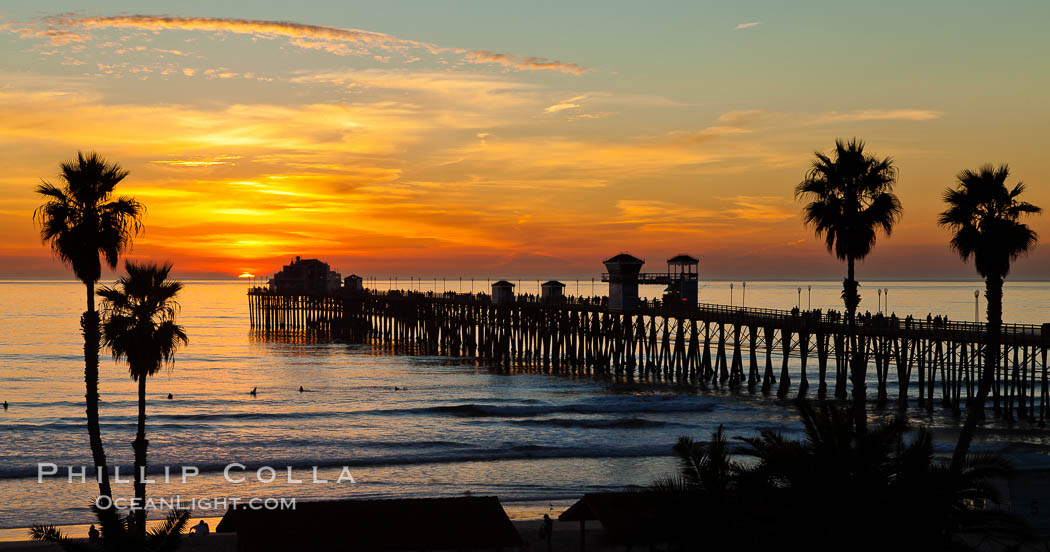 Oceanside Pier at sunset, clouds and palm trees with a brilliant sky at dusk. California, USA, natural history stock photograph, photo id 27611