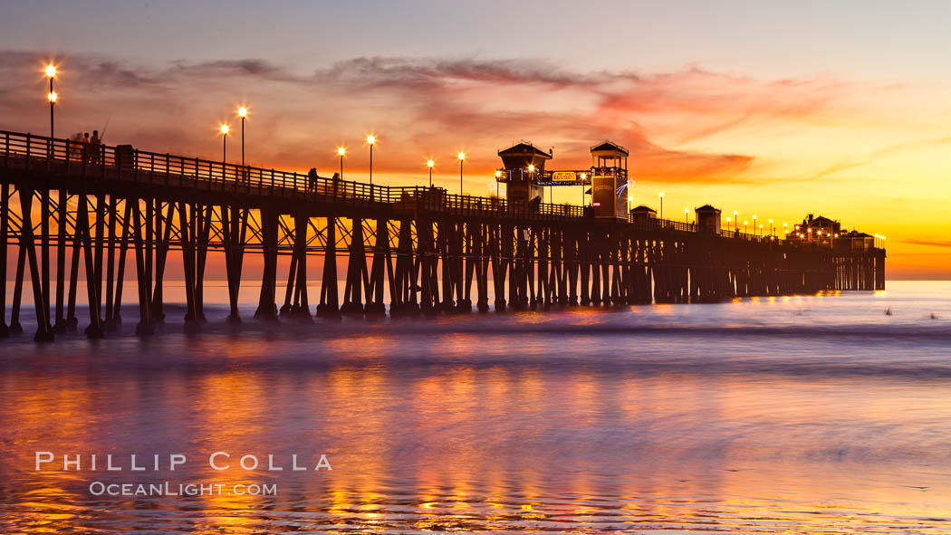 Oceanside Pier at sunset, clouds with a brilliant sky at dusk, the lights on the pier are lit. California, USA, natural history stock photograph, photo id 27615