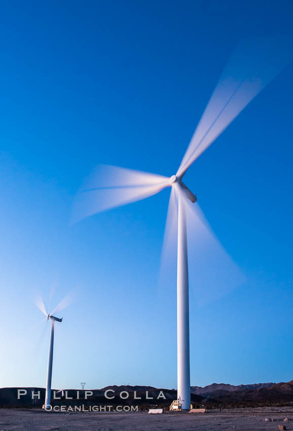 Ocotillo Express Wind Energy Projects, moving turbines lit by the rising sun,