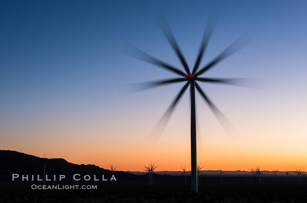 Ocotillo Express Wind Energy Projects, moving turbines lit by the rising sun,