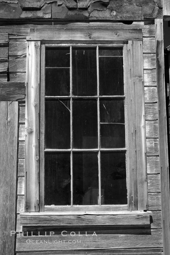 Battered old window and frame on whats left of a small private home., natural history stock photograph, photo id 23314