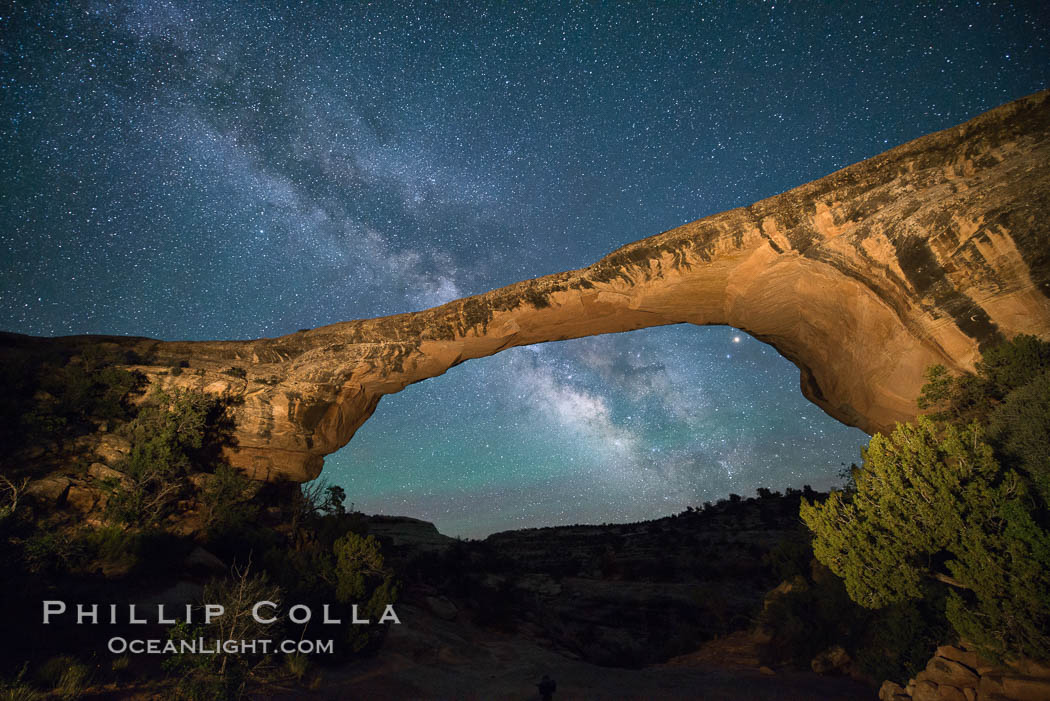 Owachomo Bridge and Milky Way.  Owachomo Bridge, a natural stone bridge standing 106' high and spanning 130' wide,stretches across a canyon with the Milky Way crossing the night sky. Natural Bridges National Monument, Utah, USA, natural history stock photograph, photo id 28544