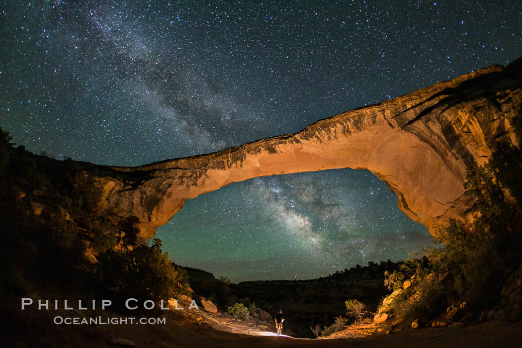 Owachomo Bridge and Milky Way.  Owachomo Bridge, a natural stone bridge standing 106' high and spanning 130' wide,stretches across a canyon with the Milky Way crossing the night sky. Natural Bridges National Monument, Utah, USA, natural history stock photograph, photo id 28548