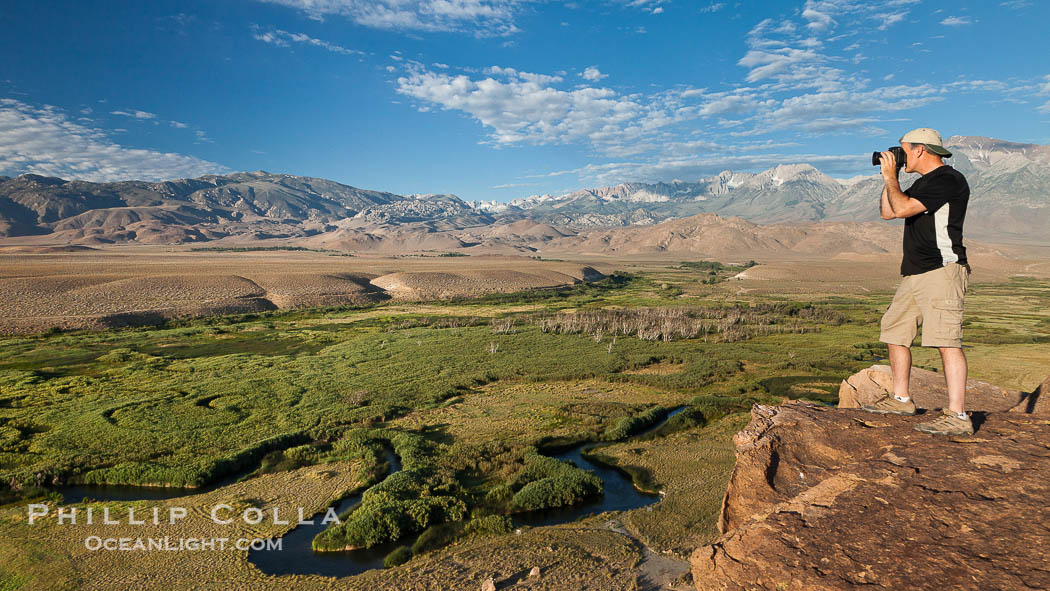 Photographer over Owens River valley, Sierra Nevada mountain range in distance, viewed from Volcanic Tablelands near Bishop, California., natural history stock photograph, photo id 26985