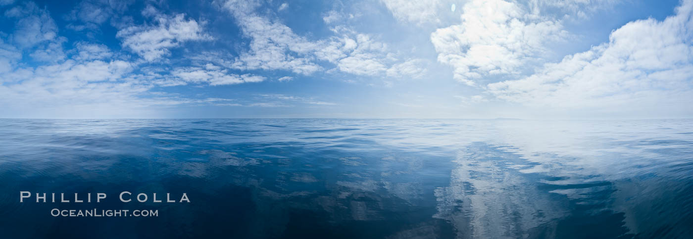 Ocean surface panorama, glassy calm ocean water offshore of California, clouds and sky., natural history stock photograph, photo id 26804