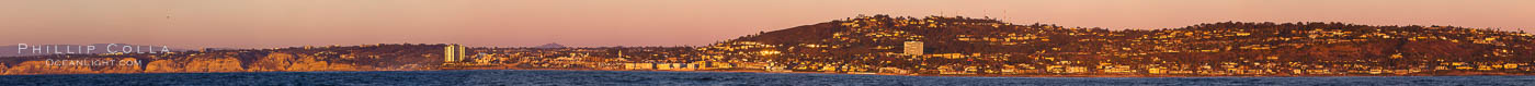 Panorama of La Jolla, with Mount Soledad aglow at sunset, viewed from the Pacific Ocean offshore of San Diego
