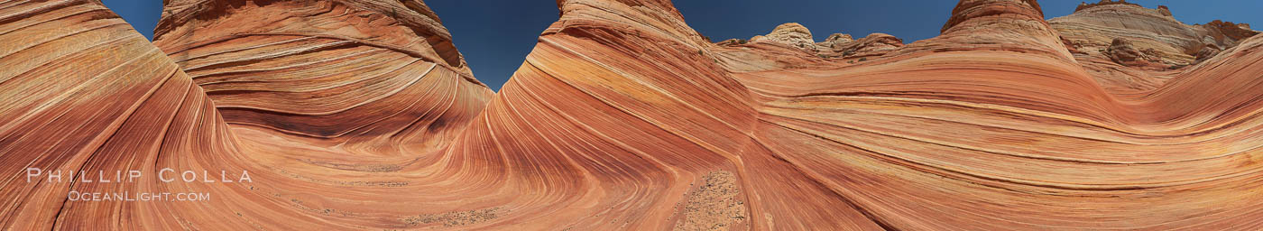 Panorama of the Wave. The Wave is a sweeping, dramatic display of eroded sandstone, forged by eons of water and wind erosion, laying bare striations formed from compacted sand dunes over millenia. This panoramic picture is formed from thirteen individual photographs, North Coyote Buttes, Paria Canyon-Vermilion Cliffs Wilderness, Arizona