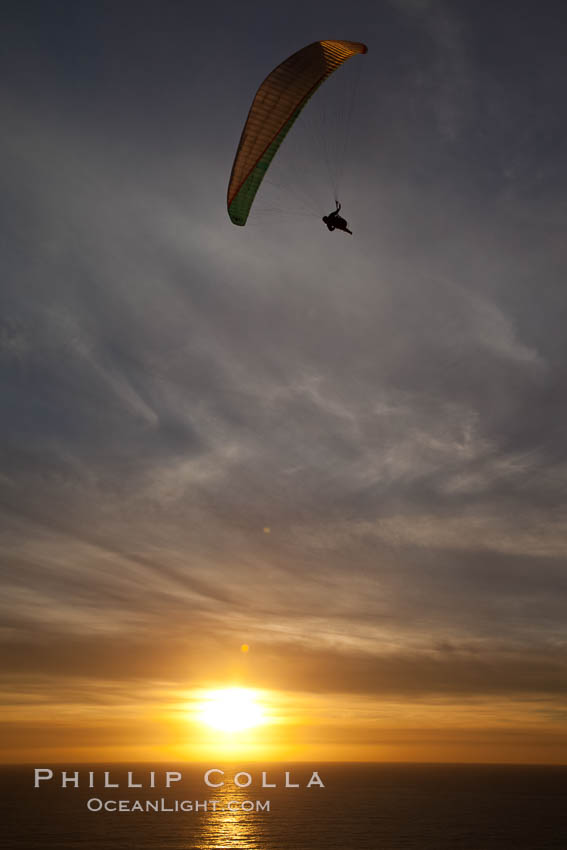 Paraglider soaring at Torrey Pines Gliderport, sunset, flying over the Pacific Ocean. La Jolla, California, USA, natural history stock photograph, photo id 24294