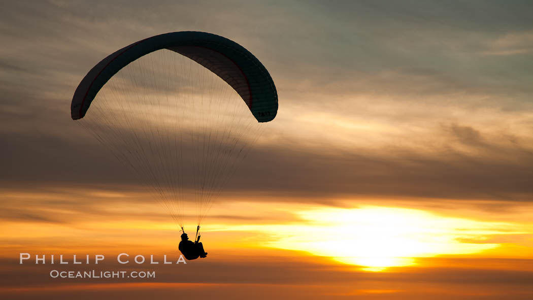 Paraglider soaring at Torrey Pines Gliderport, sunset, flying over the Pacific Ocean. La Jolla, California, USA, natural history stock photograph, photo id 24292