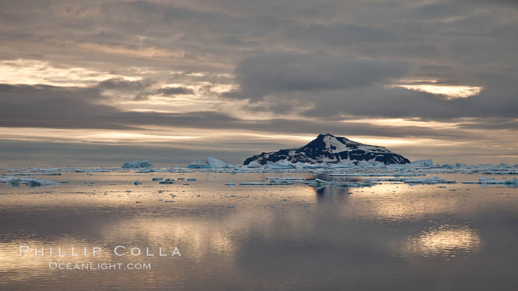 Paulet Island, near the Antarctic Peninsula, is a cinder cone flanks by lava flows on which thousands of Adelie Penguins nest. Antarctica, natural history stock photograph, photo id 24824