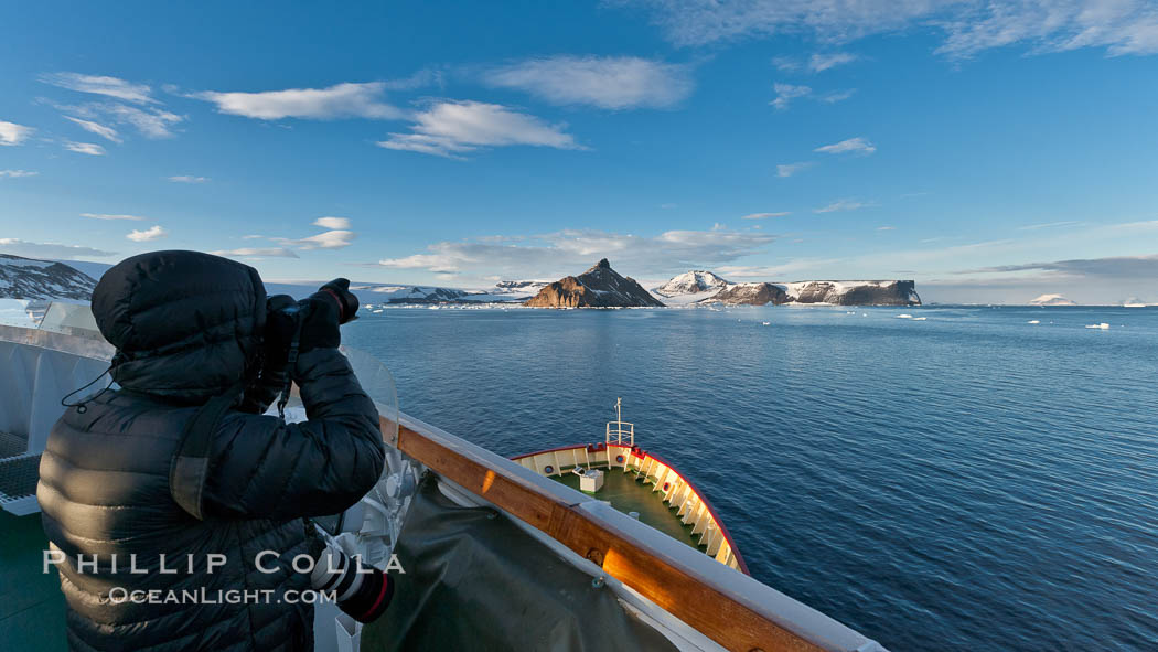Photographer making pictures as M/V Polar Star approaches Devil Island. Antarctic Peninsula, Antarctica, natural history stock photograph, photo id 26372