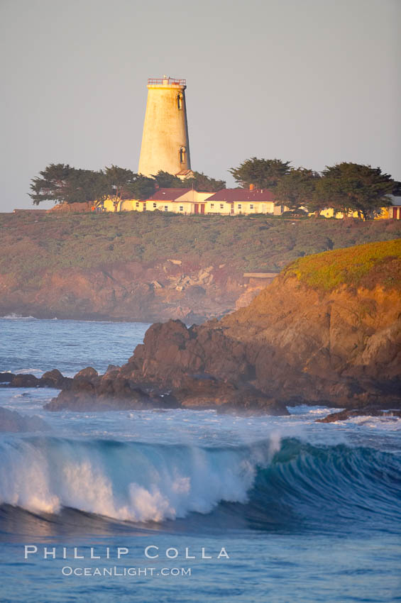 Piedras Blancas lighthouse.  Completed in 1875, the 115-foot-tall Piedras Blancas lighthouse is one of the few tall-style lighthouses on the West Coast of the United States.  Piedras Blancas, named for a group of three white rocks just offshore, is north of San Simeon, California very close to Hearst Castle. USA, natural history stock photograph, photo id 15654