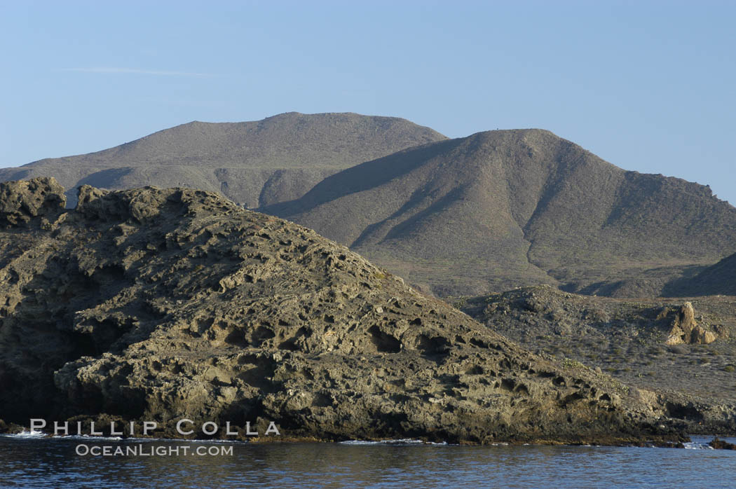 Rugged, volcanic coastline of San Clemente Island at Pyramid Cove, near the islands southeastern tip.  San Clemente Island is used as a US Navy bombing target. California, USA, natural history stock photograph, photo id 07499