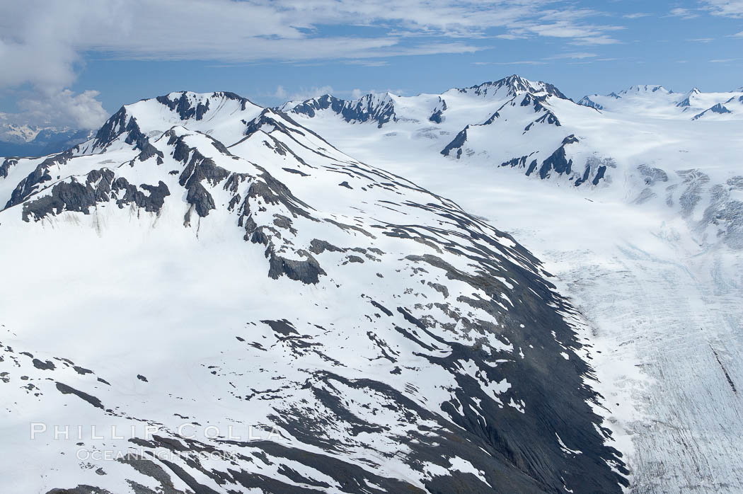 The Kenai Mountains rise above thick ice sheets and the Harding Icefield which is one of the largest icefields in Alaska and gives rise to over 30 glaciers. Kenai Fjords National Park, USA, natural history stock photograph, photo id 19035