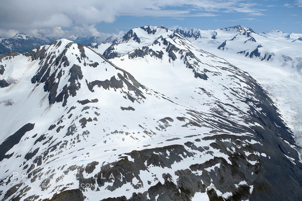 The Kenai Mountains rise above thick ice sheets and the Harding Icefield which is one of the largest icefields in Alaska and gives rise to over 30 glaciers. Kenai Fjords National Park, USA, natural history stock photograph, photo id 19049