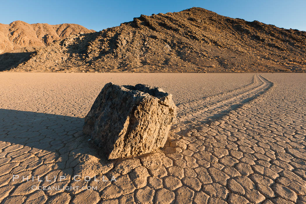 Sailing stone on the Racetrack Playa. The sliding rocks, or sailing stones, move across the mud flats of the Racetrack Playa, leaving trails behind in the mud. The explanation for their movement is not known with certainty, but many believe wind pushes the rocks over wet and perhaps icy mud in winter, Death Valley National Park, California