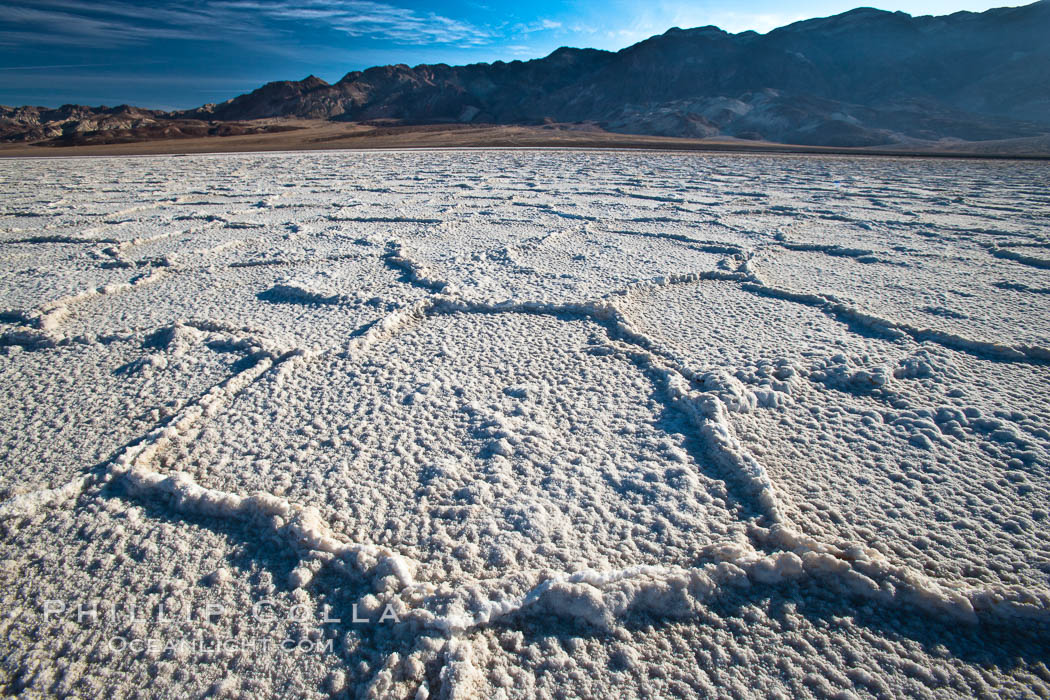 Devils Golf Course, California. Evaporated salt has formed into gnarled, complex crystalline shapes in on the salt pan of Death Valley National Park, one of the largest salt pans in the world. The shapes are constantly evolving as occasional floods submerge the salt concretions before receding and depositing more salt