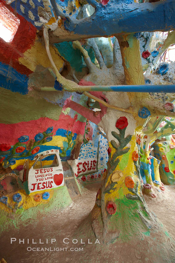 Salvation Mountain, near the desert community of Slab City and the small town of Niland on the east side of the Salton Sea.  Built over several decades by full-time resident Leonard Knight, who lives at the site, Salvation Mountain was built from over 100,000 gallons of paint, haybales, wood and metal and was created by Mr. Knight to convey the message that "God Loves Everyone". California, USA, natural history stock photograph, photo id 22512