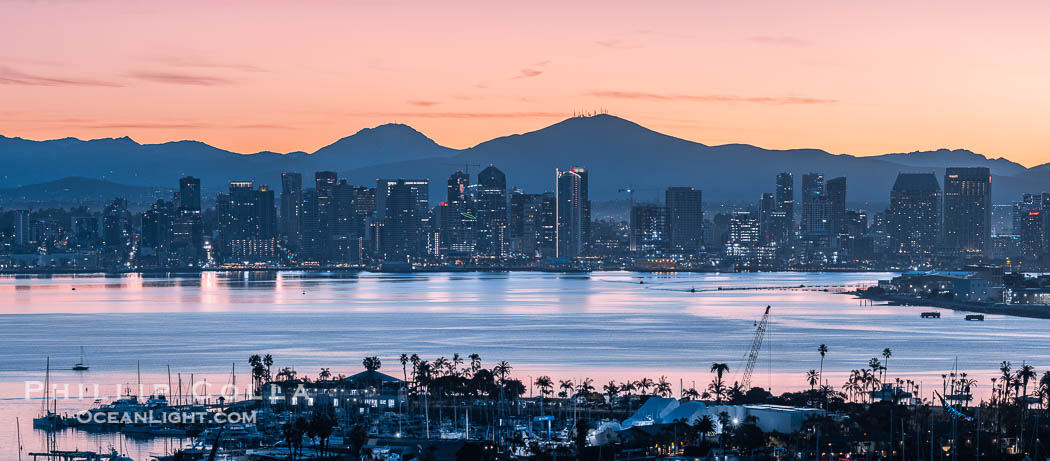 San Diego City Skyline at Dawn, panorama, sky lit up orange and still harbor in the foreground. Mount San Miguel (left) and Mount Lyons (right). California, USA, natural history stock photograph, photo id 38886