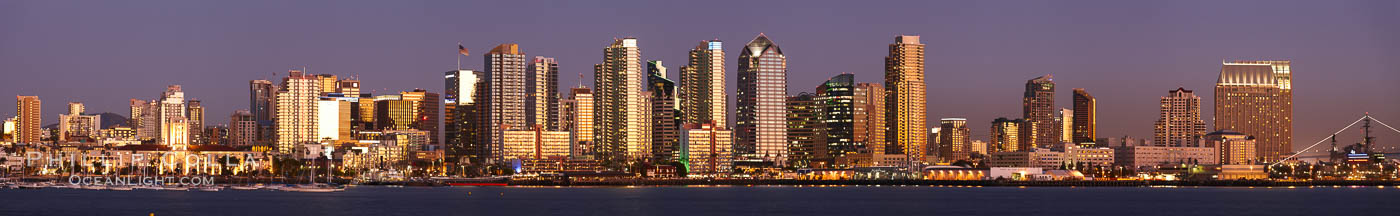 San Diego city skyline at sunset, showing the buildings of downtown San Diego rising above San Diego Harbor, viewed from Harbor Island.  A panoramic photograph, composite of six separate images. California, USA, natural history stock photograph, photo id 22256