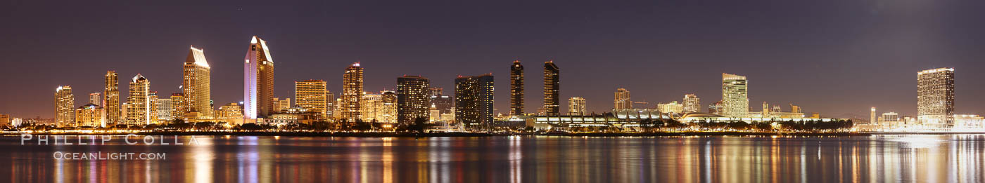 San Diego city skyline at night, showing the buildings of downtown San Diego reflected in the still waters of San Diego Harbor, viewed from Coronado Island.  A panoramic photograph, composite of five separate images. California, USA, natural history stock photograph, photo id 22266