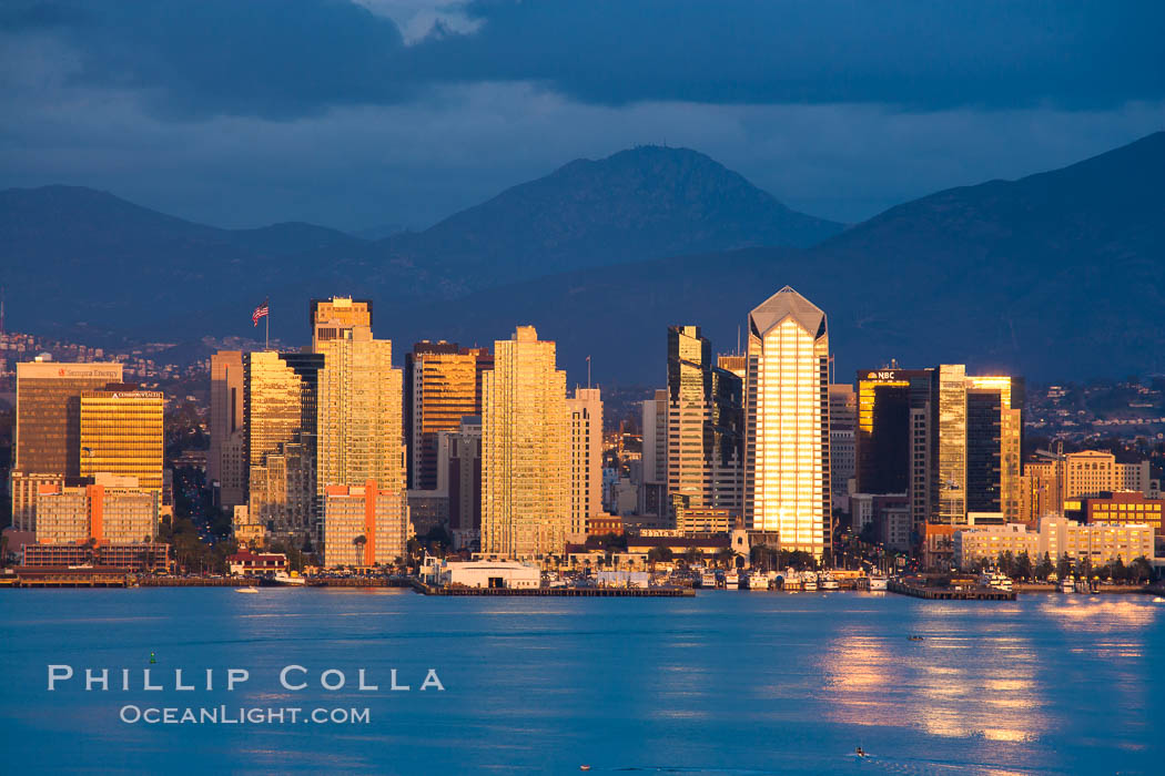 San Diego harbor skyline, late afternoon, storm clouds and mountains