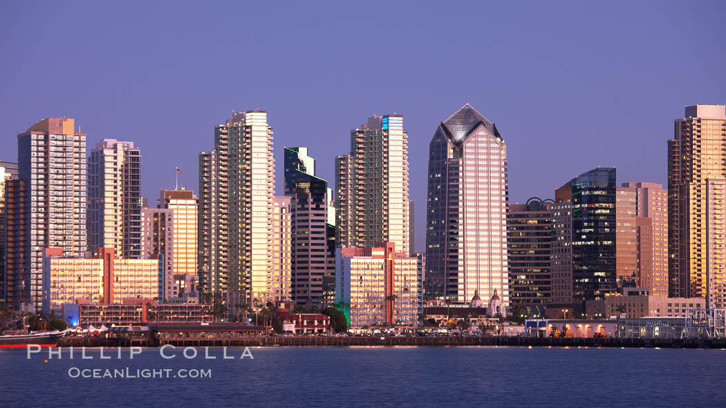 San Diego city skyline at sunset, showing the buildings of downtown San Diego rising above San Diego Harbor, viewed from Harbor Island. California, USA, natural history stock photograph, photo id 22258