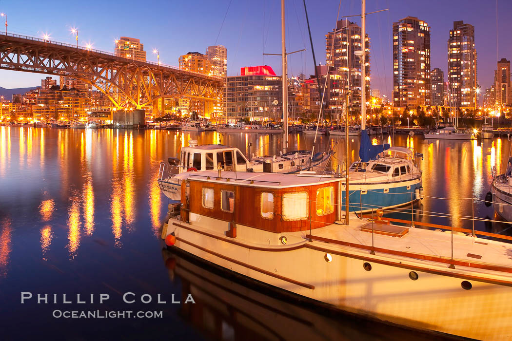 Yaletown section of Vancouver at night, including Granville Island bridge (left), viewed from Granville Island with sailboat in the foreground. British Columbia, Canada, natural history stock photograph, photo id 21169