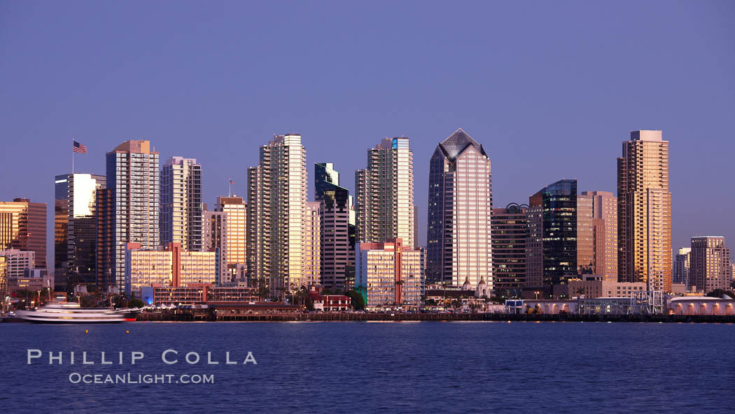 San Diego city skyline at sunset, showing the buildings of downtown San Diego rising above San Diego Harbor, viewed from Harbor Island. California, USA, natural history stock photograph, photo id 22261