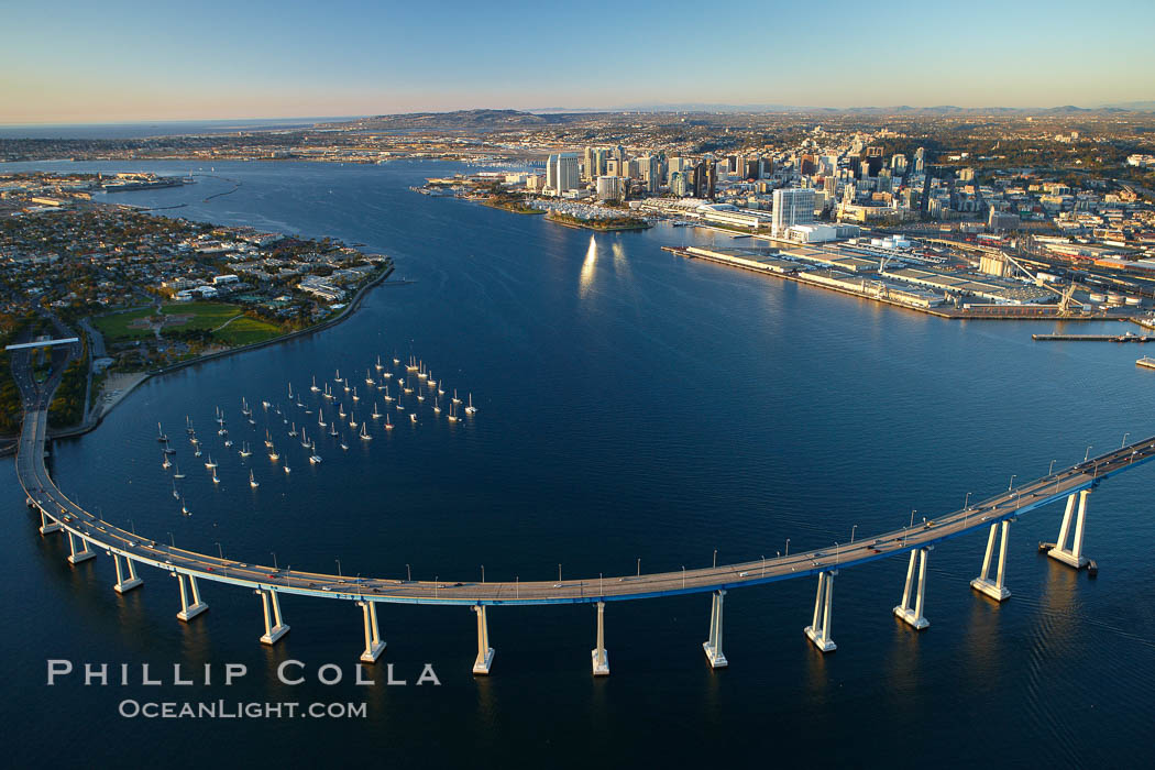 San Diego Coronado Bridge, known locally as the Coronado Bridge, links San Diego with Coronado, California.  The bridge was completed in 1969 and was a toll bridge until 2002.  It is 2.1 miles long and reaches a height of 200 feet above San Diego Bay.  Coronado Island is to the left, and downtown San Diego is to the right in this view looking north. USA, natural history stock photograph, photo id 22288