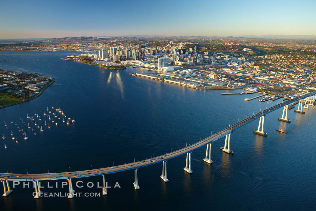 San Diego Coronado Bridge, known locally as the Coronado Bridge, links San Diego with Coronado, California.  The bridge was completed in 1969 and was a toll bridge until 2002.  It is 2.1 miles long and reaches a height of 200 feet above San Diego Bay.  Coronado Island is to the left, and downtown San Diego is to the right in this view looking north. USA, natural history stock photograph, photo id 22365