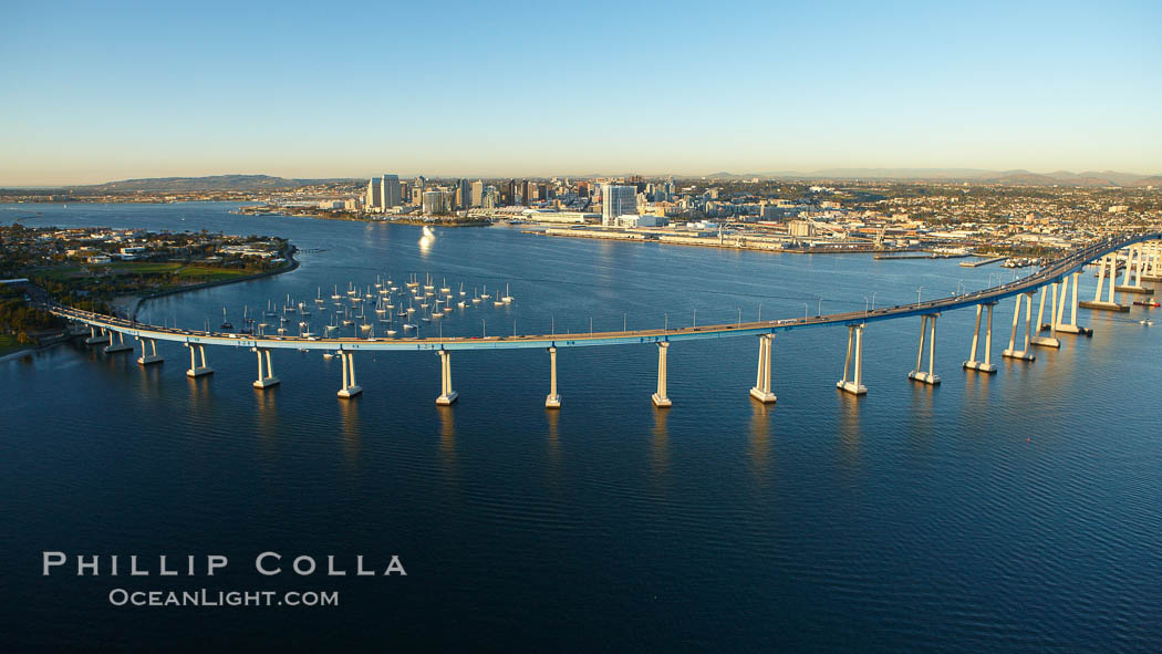 San Diego Coronado Bridge, known locally as the Coronado Bridge, links San Diego with Coronado, California.  The bridge was completed in 1969 and was a toll bridge until 2002.  It is 2.1 miles long and reaches a height of 200 feet above San Diego Bay.  Coronado Island is to the left, and downtown San Diego is to the right in this view looking north. USA, natural history stock photograph, photo id 22401