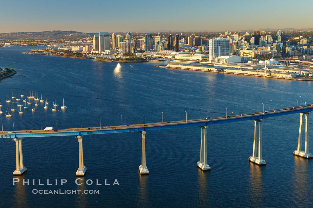 San Diego Coronado Bridge, known locally as the Coronado Bridge, links San Diego with Coronado, California.  The bridge was completed in 1969 and was a toll bridge until 2002.  It is 2.1 miles long and reaches a height of 200 feet above San Diego Bay.  Coronado Island is to the left, and downtown San Diego is to the right in this view looking north. USA, natural history stock photograph, photo id 22433