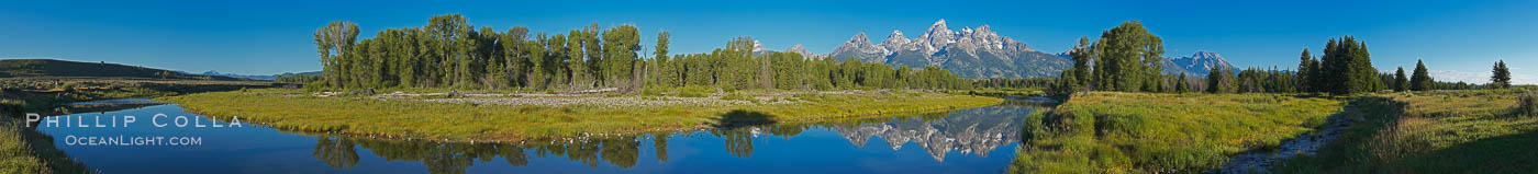 Panorama of the Teton Range reflected in the still waters of Schwabacher Landing, a sidewater of the Snake River, Grand Teton National Park, Wyoming