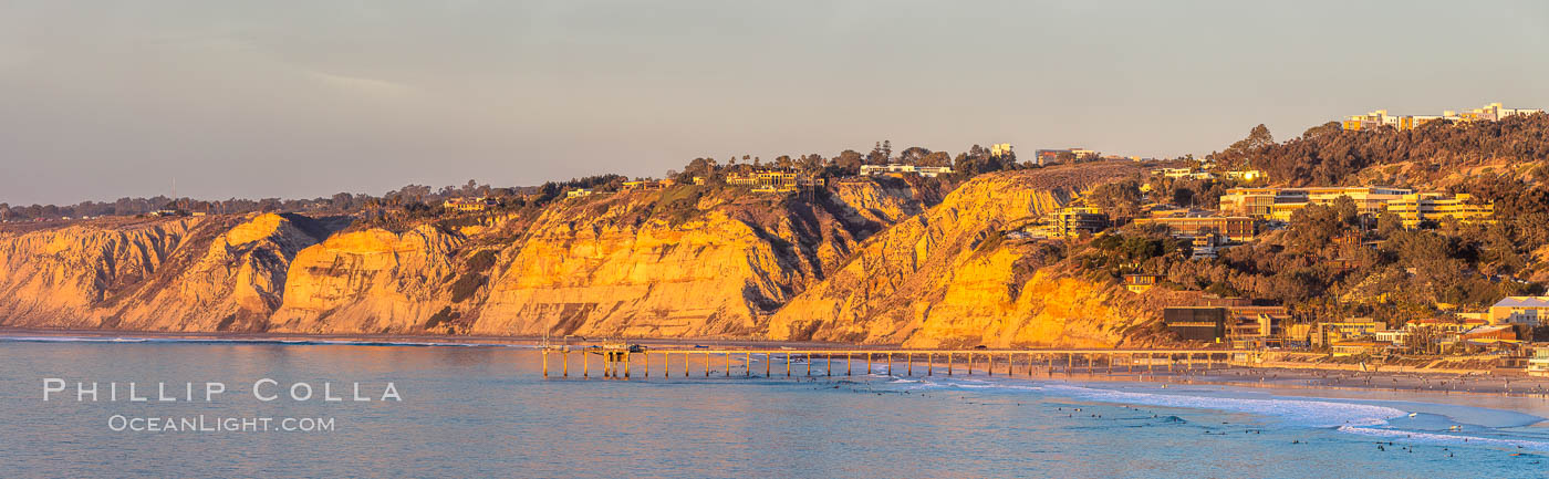 Scripps Pier and Blacks Beach, Sunset, Panorama. The Gold Coast of La Jolla basks in warm serene light as the sun sets over the Pacific Ocean. California, USA, natural history stock photograph, photo id 36674