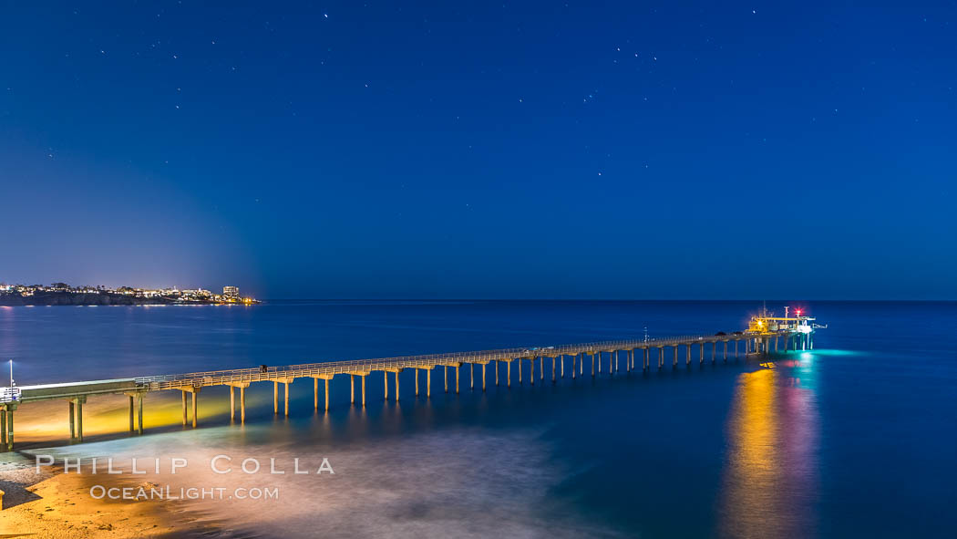 Scripps Institution of Oceanography Research Pier at night, lit with stars in the sky, old La Jolla town in the distance. California, USA, natural history stock photograph, photo id 28451