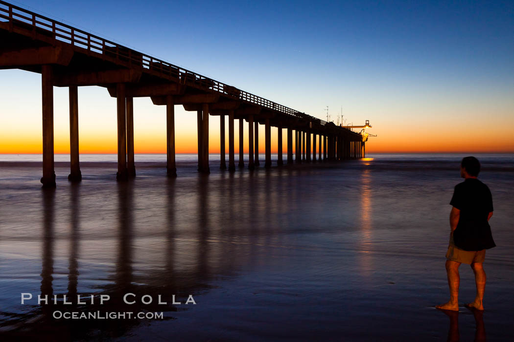 Guy watches the sunset over the SIO pier, the research pier at Scripps Institution of Oceanography SIO. La Jolla, California, USA, natural history stock photograph, photo id 26541