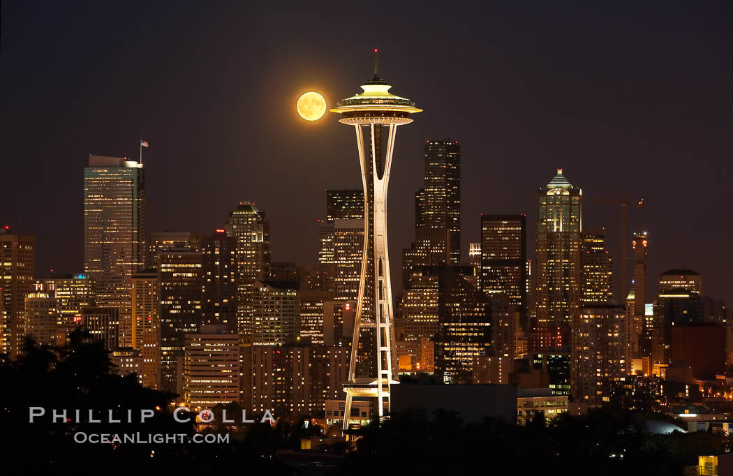 Full moon rises over Seattle city skyline, Space Needle at right. Washington, USA, natural history stock photograph, photo id 13666