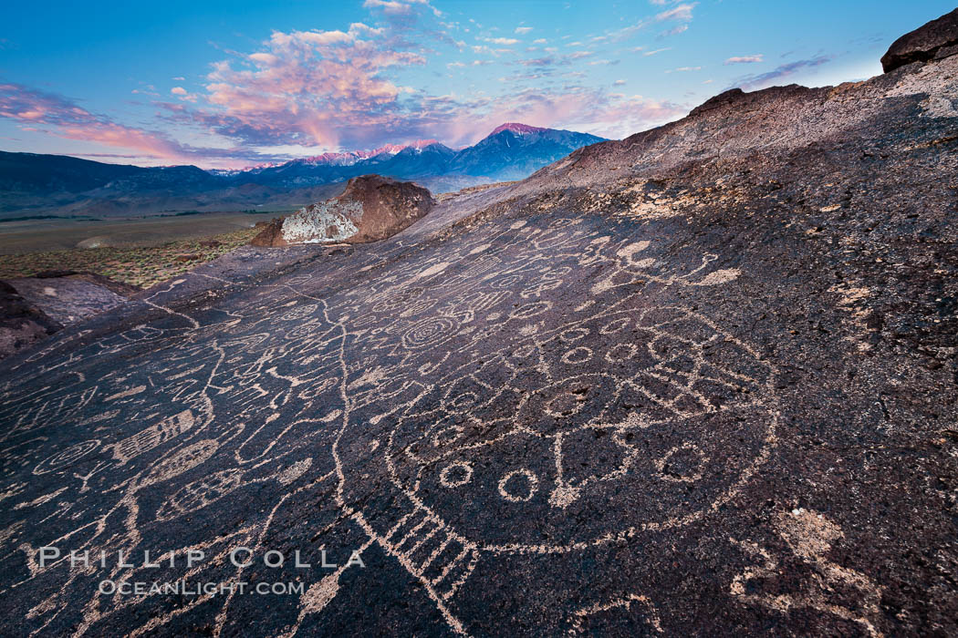 Sky Rock petroglyphs near Bishop, California.  Hidden atop an enormous boulder in the Volcanic Tablelands lies Sky Rock, a set of petroglyphs that face the sky.  These superb examples of native American petroglyph artwork are thought to be Paiute in origin, but little is known about them. USA, natural history stock photograph, photo id 27006