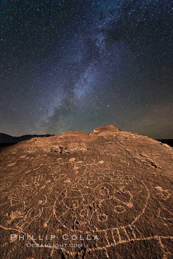 The Milky Way at Night over Sky Rock.  Sky Rock petroglyphs near Bishop, California. Hidden atop an enormous boulder in the Volcanic Tablelands lies Sky Rock, a set of petroglyphs that face the sky. These superb examples of native American petroglyph artwork are thought to be Paiute in origin, but little is known about them. USA, natural history stock photograph, photo id 28810