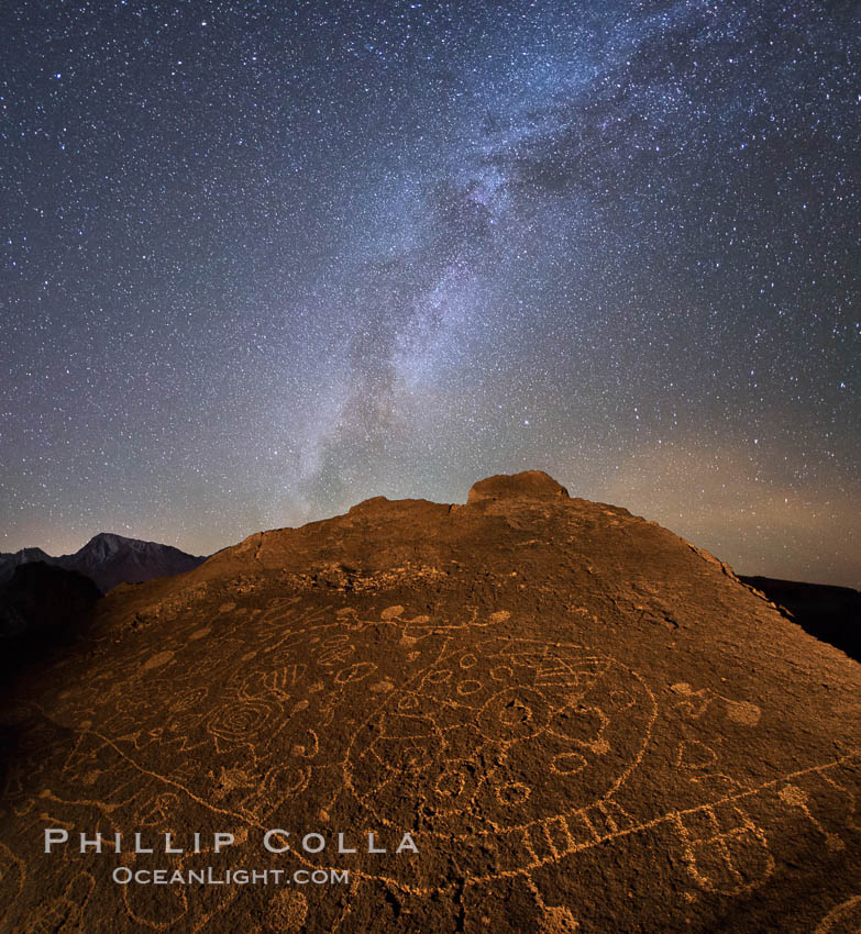 The Milky Way at Night over Sky Rock.  Sky Rock petroglyphs near Bishop, California. Hidden atop an enormous boulder in the Volcanic Tablelands lies Sky Rock, a set of petroglyphs that face the sky. These superb examples of native American petroglyph artwork are thought to be Paiute in origin, but little is known about them. USA, natural history stock photograph, photo id 28809