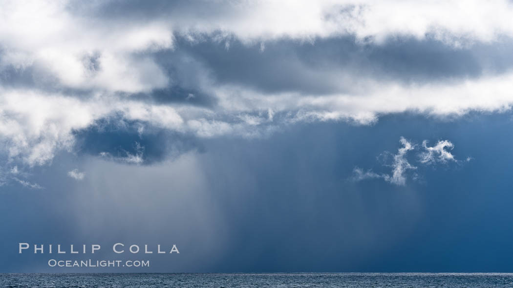 Clouds, weather and light mix in neverending forms over the open ocean of Scotia Sea, in the Southern Ocean