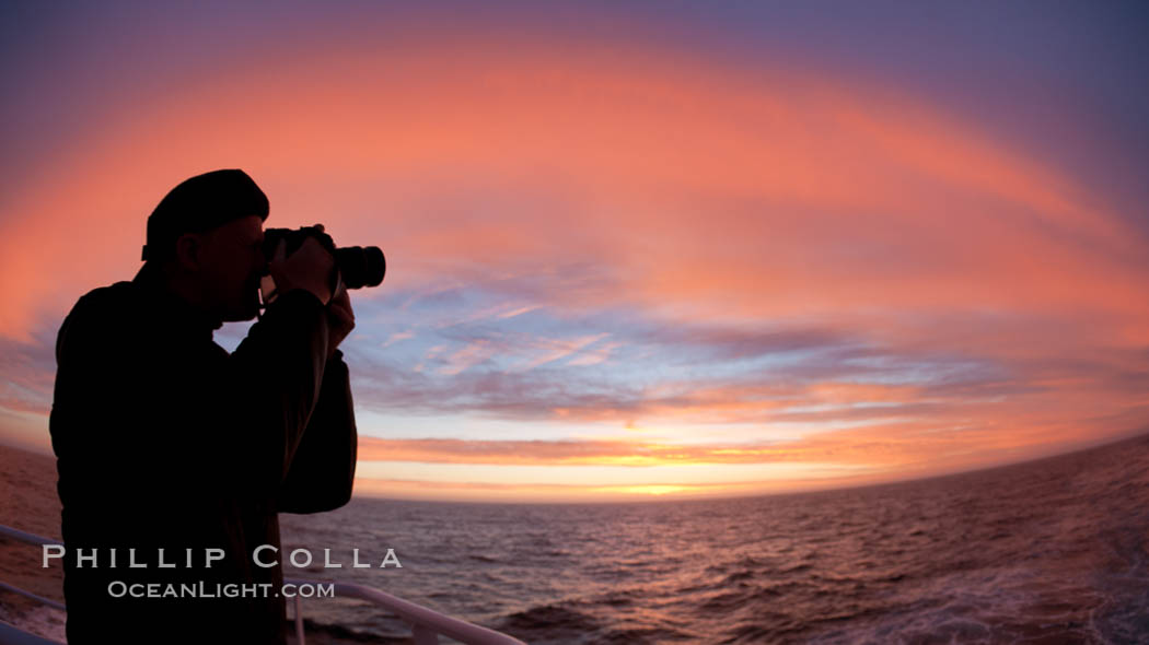 Photographer takes picture of a spectacular sunset arch, spanning the heavens from horizon to horizon, over the open sea between the Falkland Islands and South Georgia Island. Southern Ocean, natural history stock photograph, photo id 24183