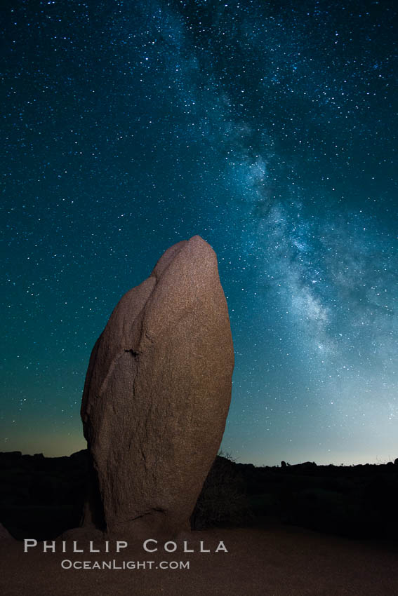 Standing stone and Milky Way, stars fill the night sky. Joshua Tree National Park, California, USA, natural history stock photograph, photo id 27802