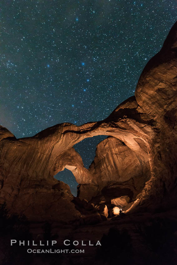 Stars over Double Arch, Arches National Park (Note: this image was created before a ban on light-painting in Arches National Park was put into effect.  Light-painting is no longer permitted in Arches National Park). Utah, USA, natural history stock photograph, photo id 29251