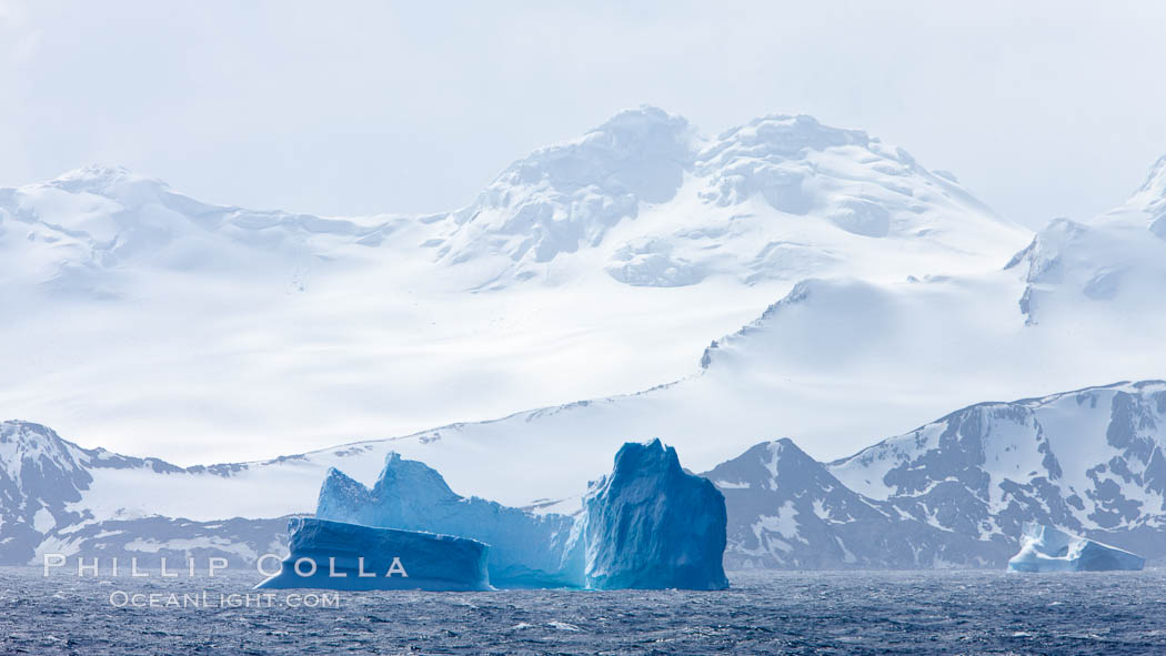 Coronation Island, is the largest of the South Orkney Islands, reaching 4,153' (1,266m) above sea level.  While it is largely covered by ice, Coronation Island also is home to some tundra habitat, and is inhabited by many seals, penguins and seabirds