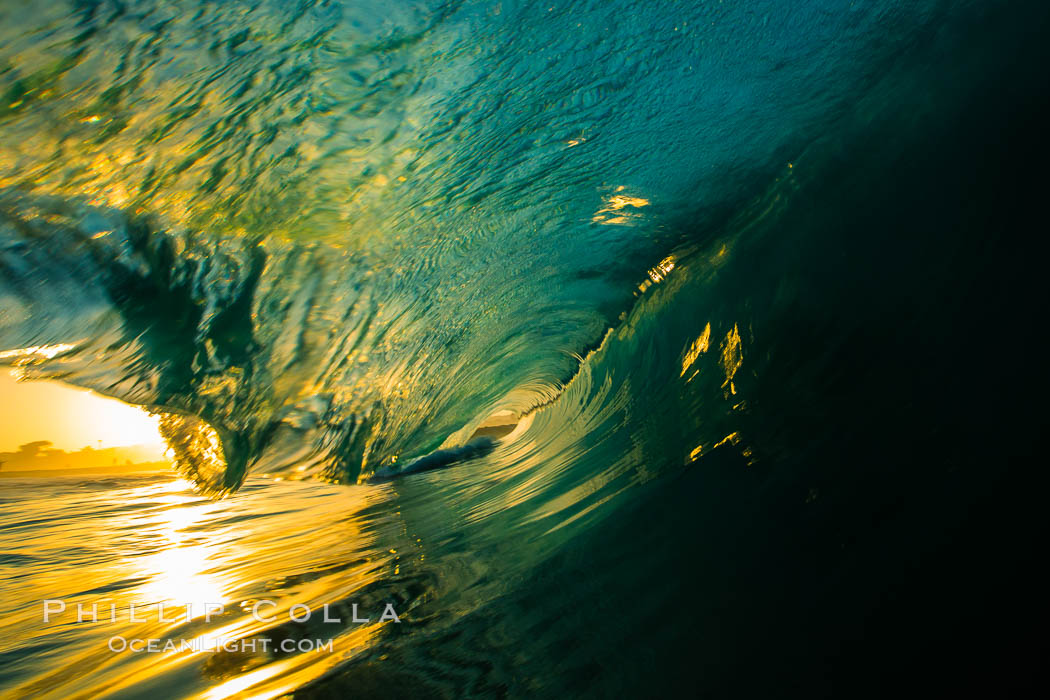 Sunrise breaking wave, dawn surf, The Wedge, Newport Beach, California