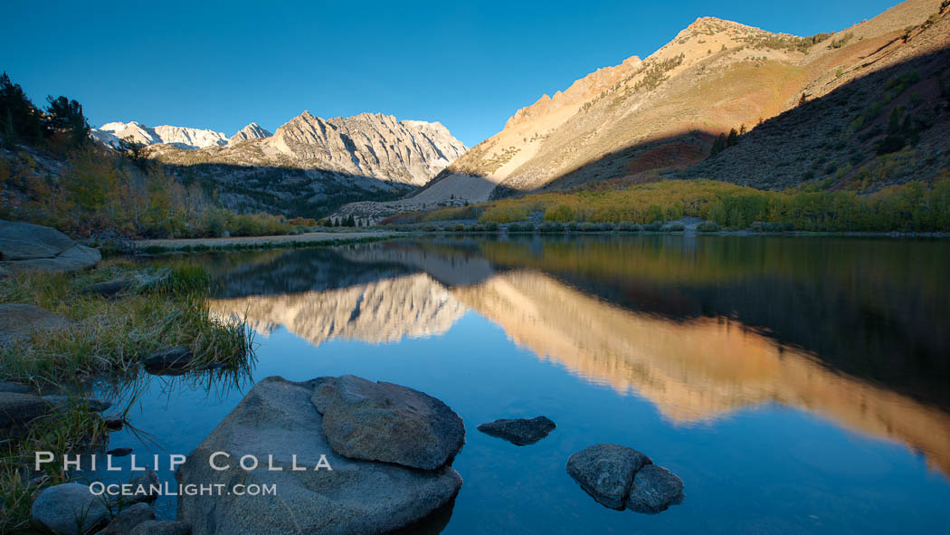 Sunrise on Paiute Peak, reflected in North Lake in the eastern Sierra Nevada, in autumn. Bishop Creek Canyon Sierra Nevada Mountains, California, USA, natural history stock photograph, photo id 26058